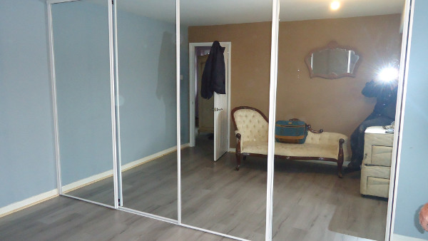 Mirrored sliding wardrobe doors.